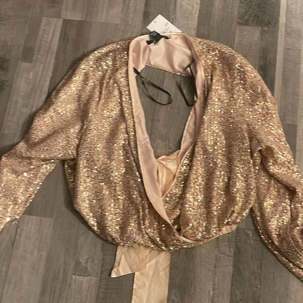 Gold sequins top. Bow on back